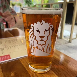 a glass of beer on a table