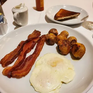 2 egg breakfast with pre-buttered gluten-free toast. Potatoes are seasoned. Good bacon.