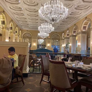 a man sitting at a table in a restaurant