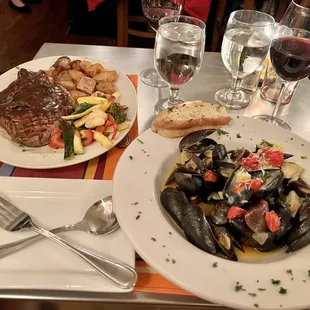 Ranchers reserve rib eye steak and mussels with white wine sauce