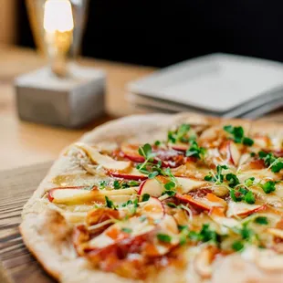 a pizza on a cutting board