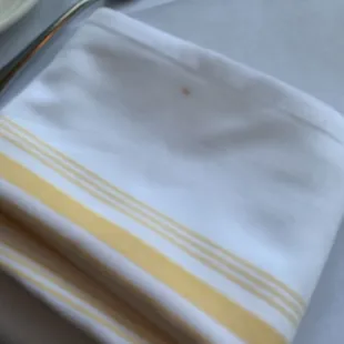 a fork and a napkin on a table