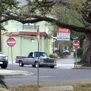 a pickup truck driving down a street
