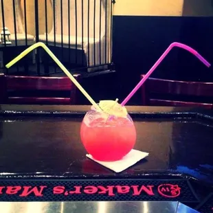 a drink with two straws in it