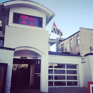 the entrance to a building with a clock tower
