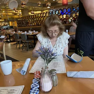 My wife looking at the menu to figure out what she'll be having