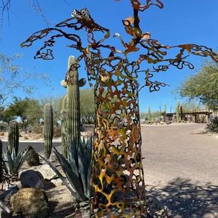 a metal sculpture of a cactus
