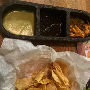 Chips, salsa, and pickled julienned veggies.