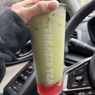 strawberry matcha latte with strawberry purée and jelly