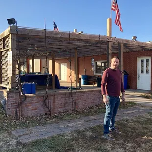 a man standing in front of a building