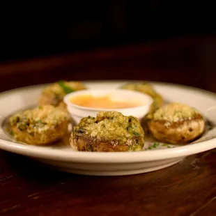 Mushrooms stuffed with lump crab, spinach, and cream cheese, topped with bacon and remoulade.