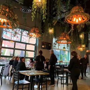 people sitting at tables in a restaurant