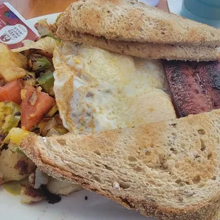 2 Eggs...with Hot Smoked Sausage, loaded up Home Fries and Rye Toast. (Plus...coffee w Bailey's Irish Cream and Jameson Whiskey)