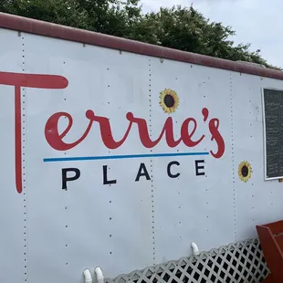 a white trailer with red lettering