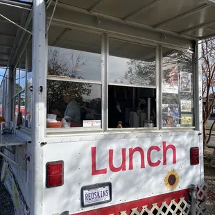 a food truck with a window open