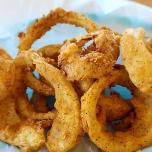 Hand breaded onion rings.