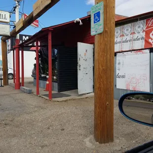 a view of a storefront from a car window