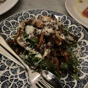 a plate of food with a fork and knife