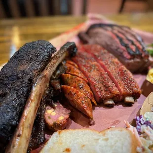 Beef rib, jalapeño cheddar sausage, pork ribs and brisket with all the trimmings