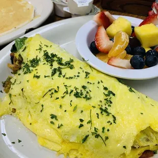 Veggie omelet with side of fruit and pancake $10 as of Jan 2023 great value