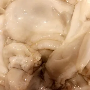 a close up of a crab in a colander