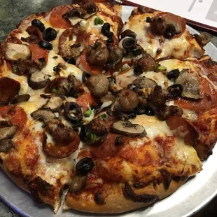 Build Your Own Pizza mini. Pepperoni, Italian Sausage, Linguisa, Mushrooms, Black Olives and Green Onions!
