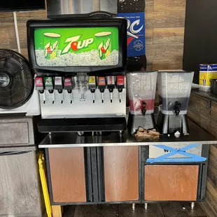 a counter with a tv and a blender
