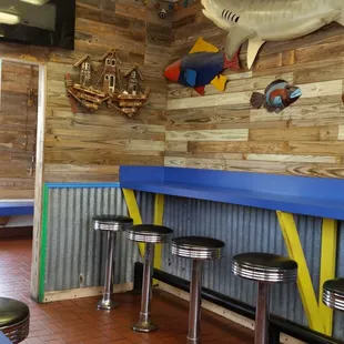 Small but adequate eating area with booth seating.