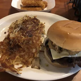 Mushroom &amp; Swiss cheeseburger with hash browns.