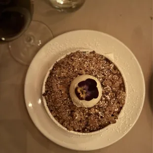 Apple-cranberry crisp with pecans and vanilla ice cream