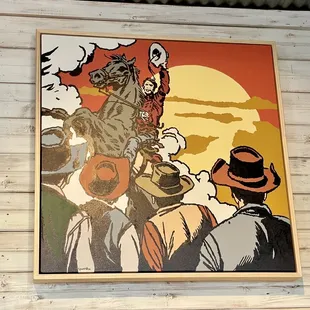 Art work displayed in cafe, one of many paintings in there.