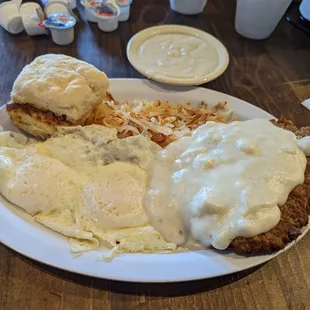 Chicken fried steak, two eggs over medium, hash browns and homemade biscuit and gravy.