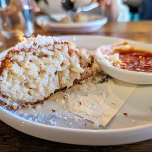 Cross section. Arancini. $16. Risotto, salsa Calabrese.