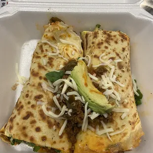 Chorizo and avocado crepe cut in half