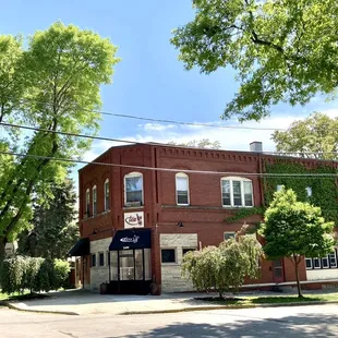 a red brick building on a street corner