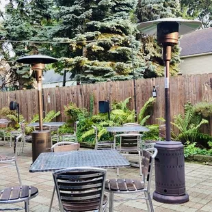 a patio area with tables and chairs