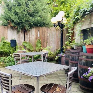 a patio with a table and chairs