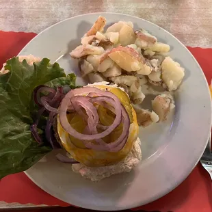 Cajun burger with a side of boiled red potatoes