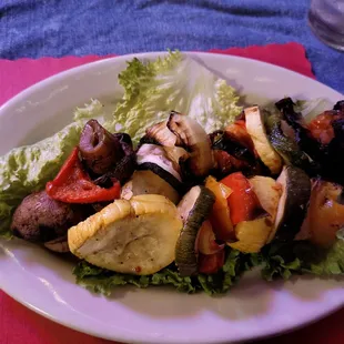 a plate of vegetables on a table