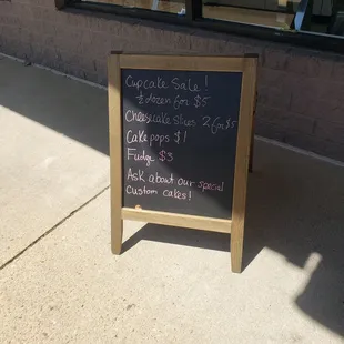 a chalkboard sign outside of a store