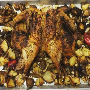 Butterflied turkey with roasted vegetables.Available for the holidays.
