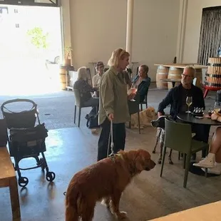 Tasting Room with Patrons at smaller tables.
