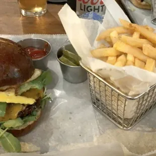 Build your own burger: beef patty, pretzel bun, cheddar, avocado, arugula, and a fried egg!