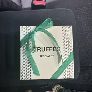 She wrapped the box in a green ribbon for me!