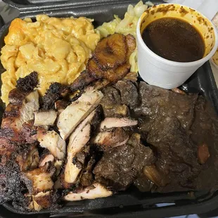 Jerk chicken Short rib Macaroni Cabbage Salad On white rice