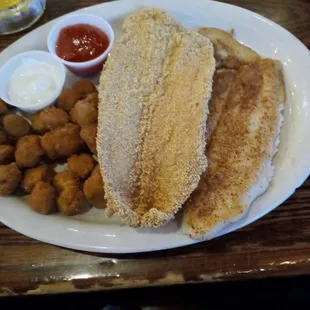 Catfish 1 fried and 1 grilled, with fried okra and a cup of gumbo. You wont be disappointed. It was Yummie