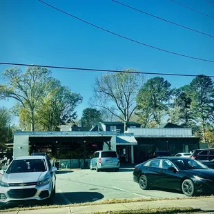 cars parked in front of a convenience store