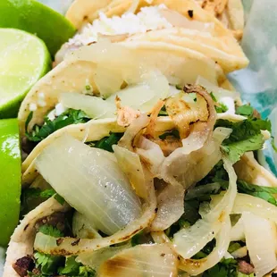 Steak tacos ( believe me, there is steak under the bed of grilled onions :D)