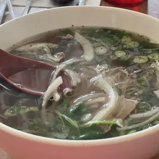 a bowl of soup with a spoon in it