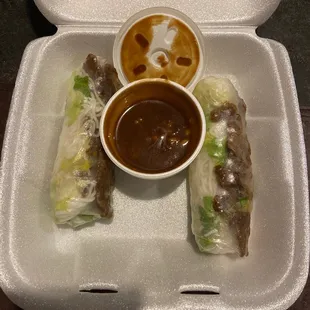 a plate of food with dipping sauce